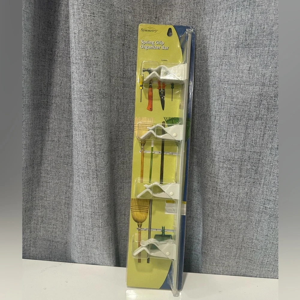 Symmetry spring grip Wall Organizer with White Holders. NWT.